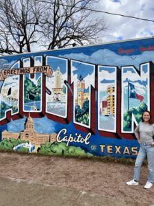 Girl in front of mural