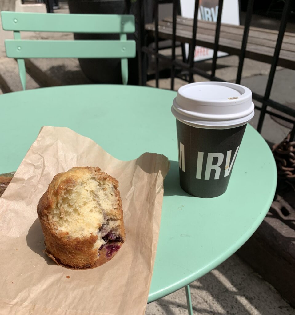 Muffin and Coffee on blue outdoor table