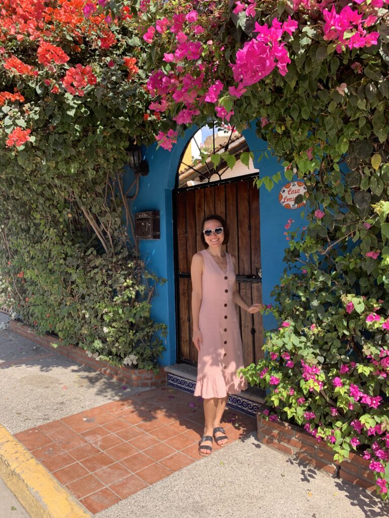 Woman in front of Mexican door