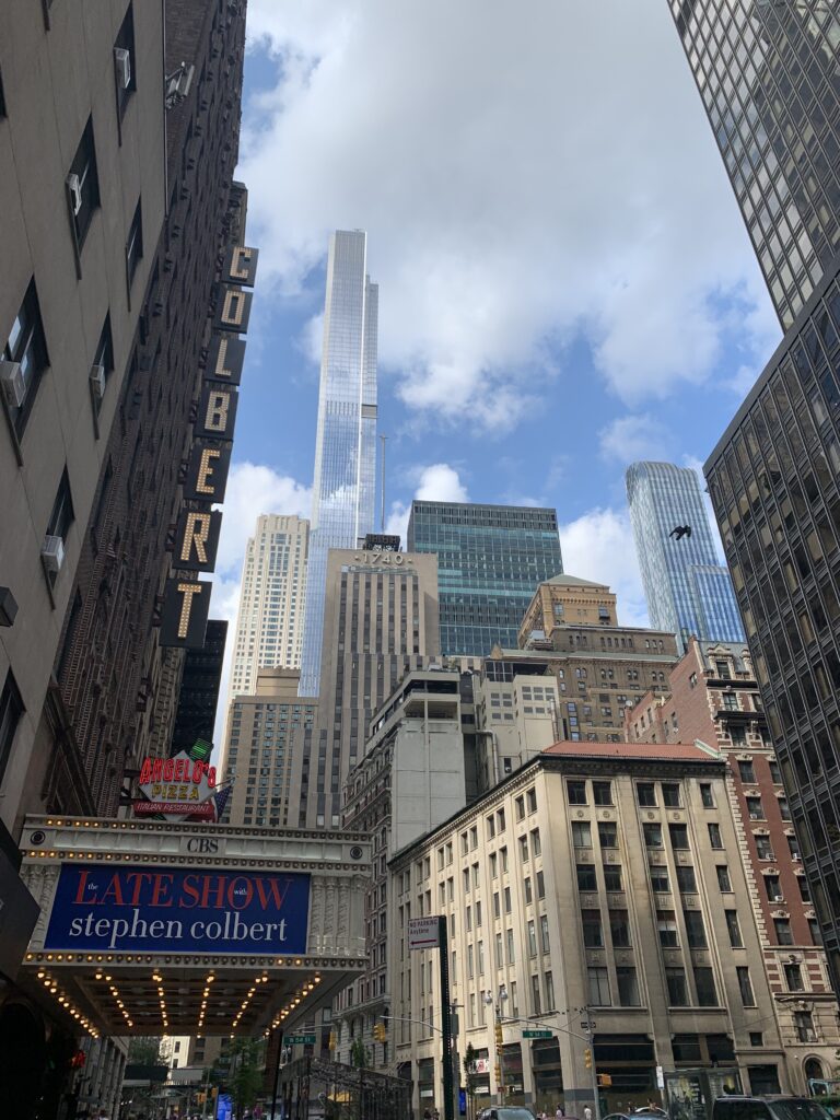 Colbert Show sign with City background