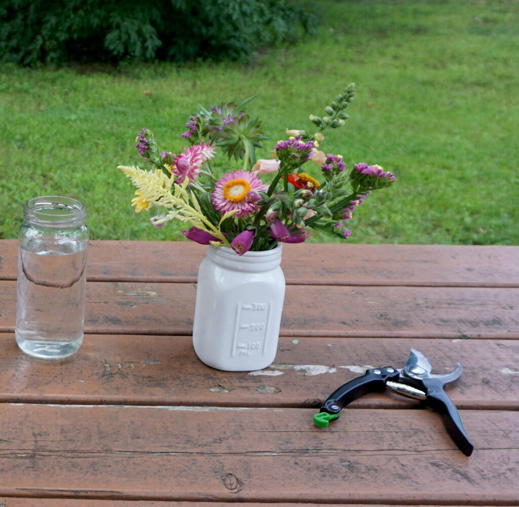 Flowers in white mason jar