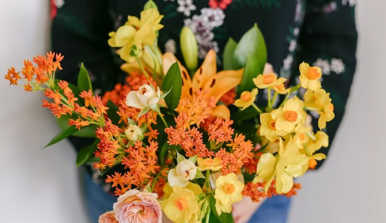 orange and yellow flowers in vase