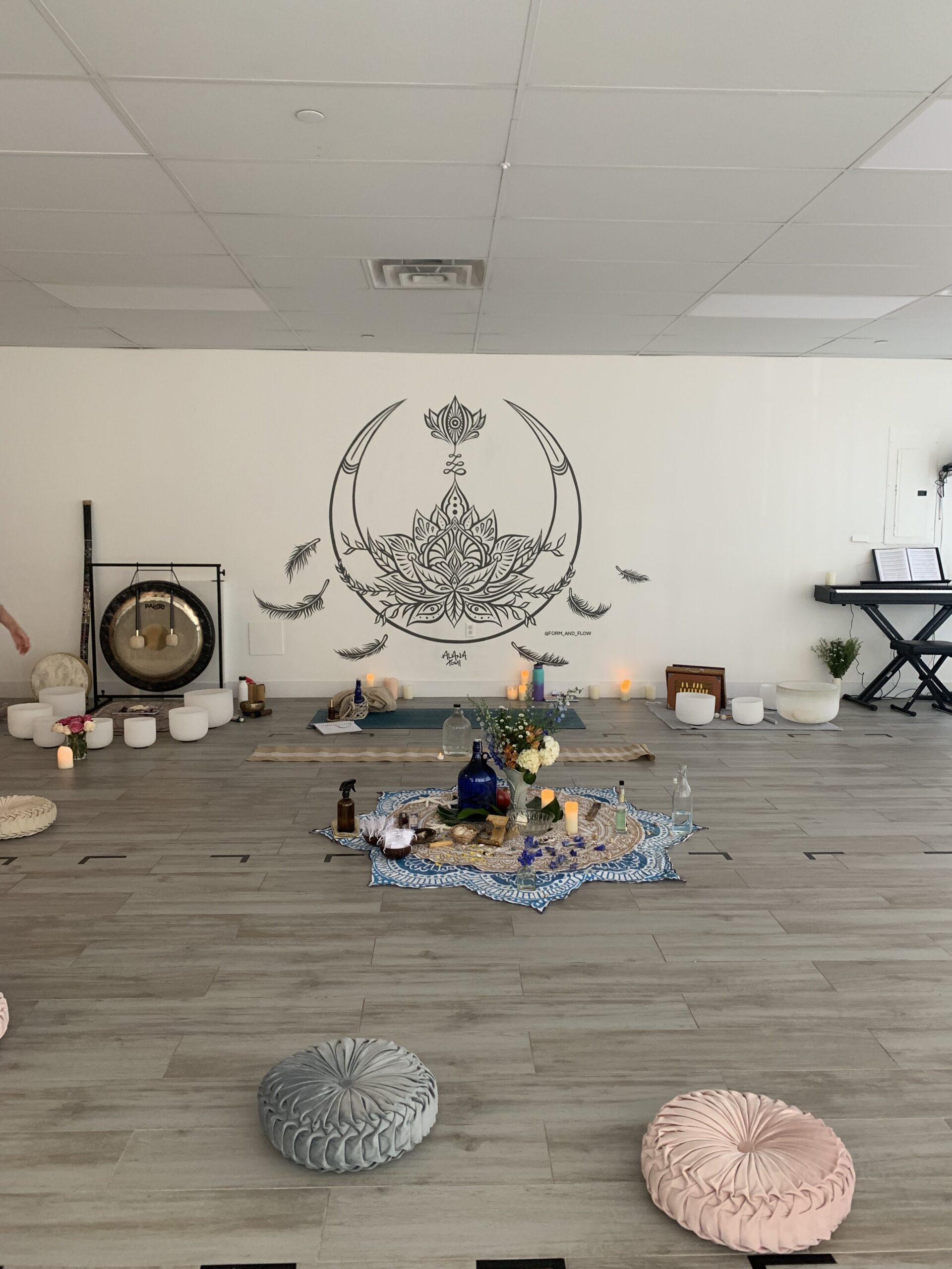 yoga studio with altar and sound bowl setup