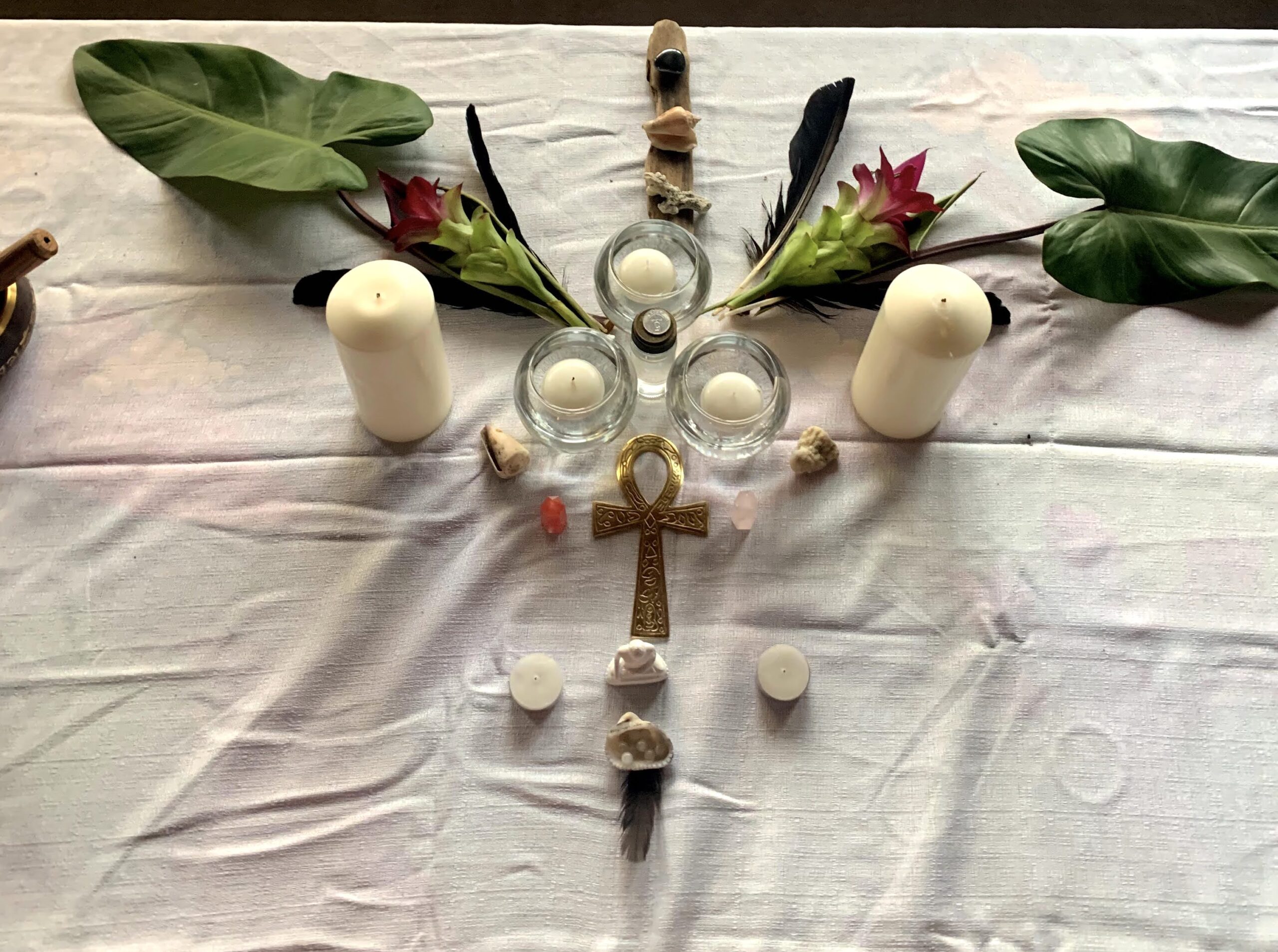 altar with leaves, candles and stones