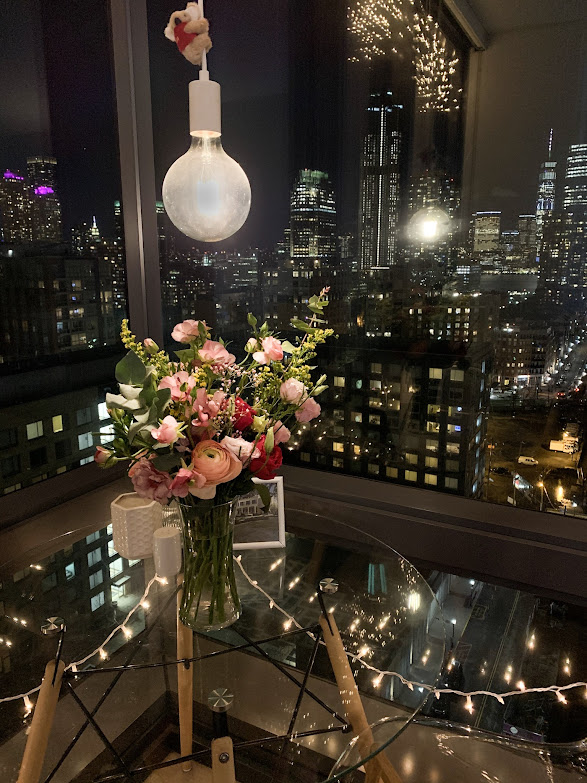 Large bouquet on table with city skyline