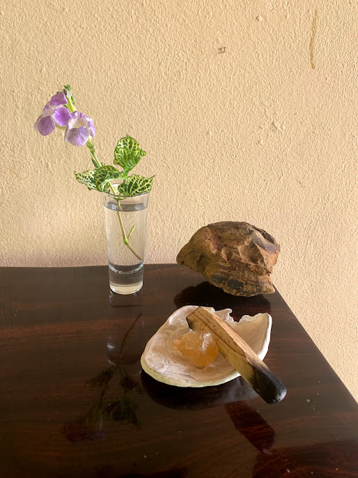 Stone, flower, palo santo and crystal