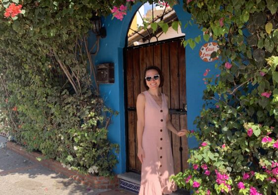 Woman in front of Mexican door