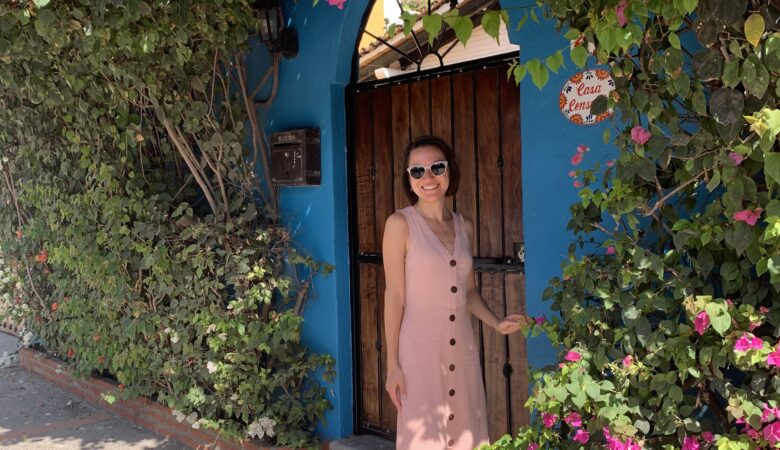 Woman in front of Mexican door