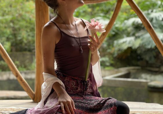 woman holding a flower