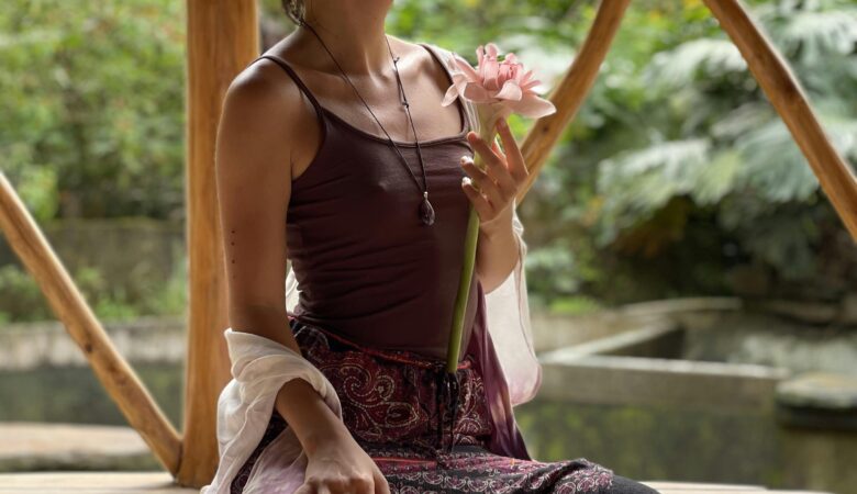 woman holding a flower