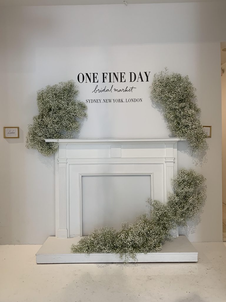 Bridal market entrance wall accented with baby's breath installation, floating.